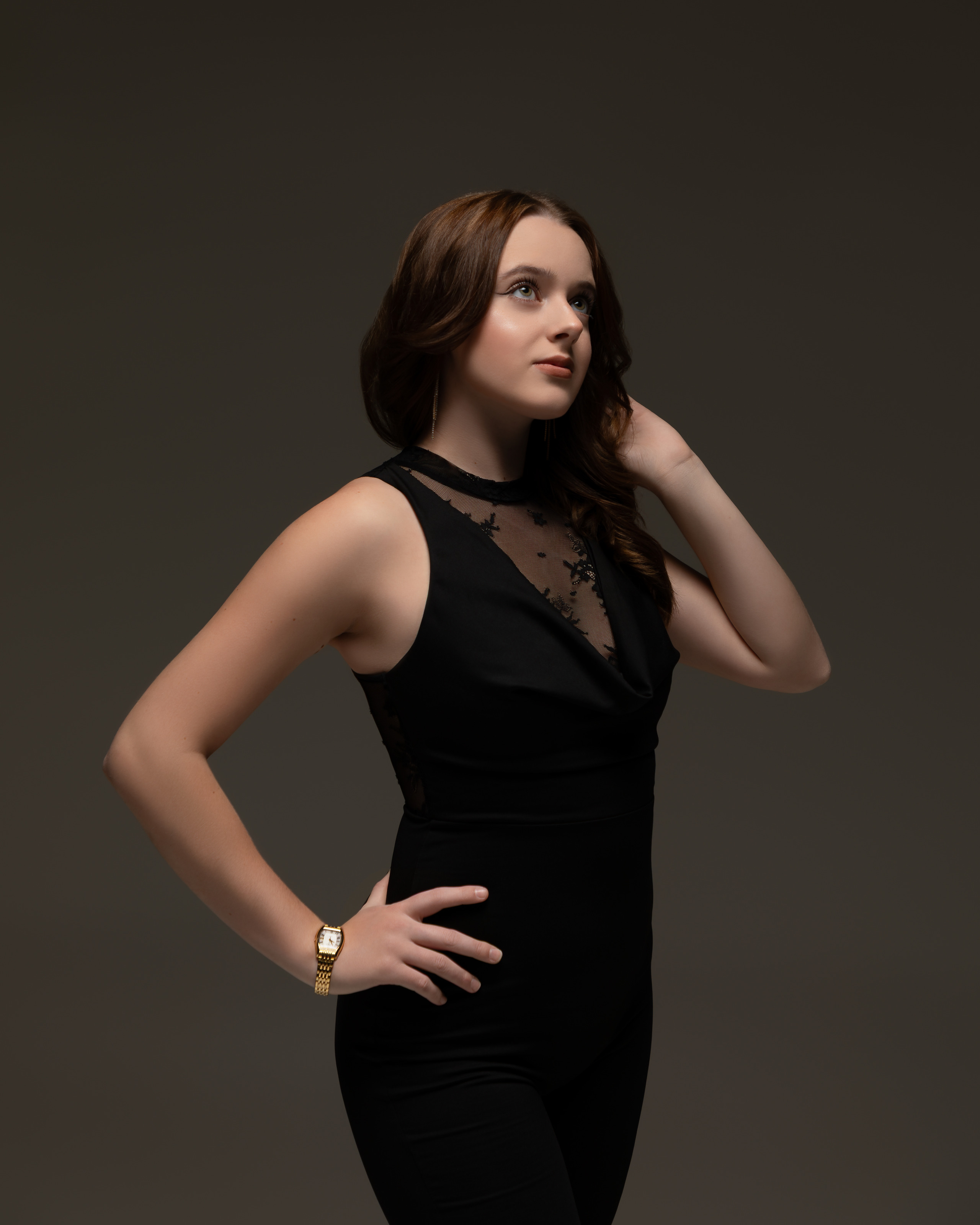 Studio portrait in a black jumpsuit, elegant style - photograph 17
